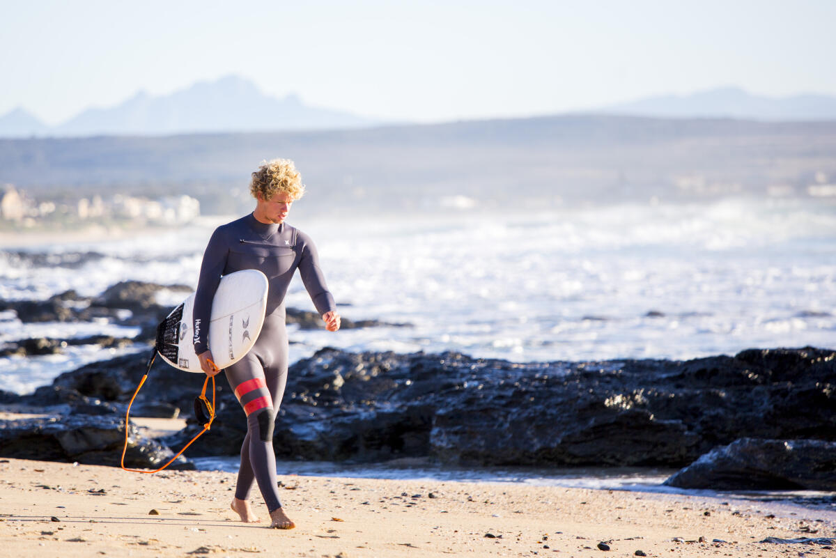 John John Florence of Hawaii   heads out for a free surf at Supertubes at the Corona Open J-Bay.