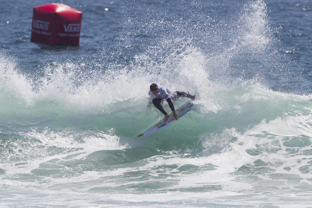 Nolan Rapoza surfing during Round Two of the Junior Men's at the 2016 Vans US Open of Surfing.