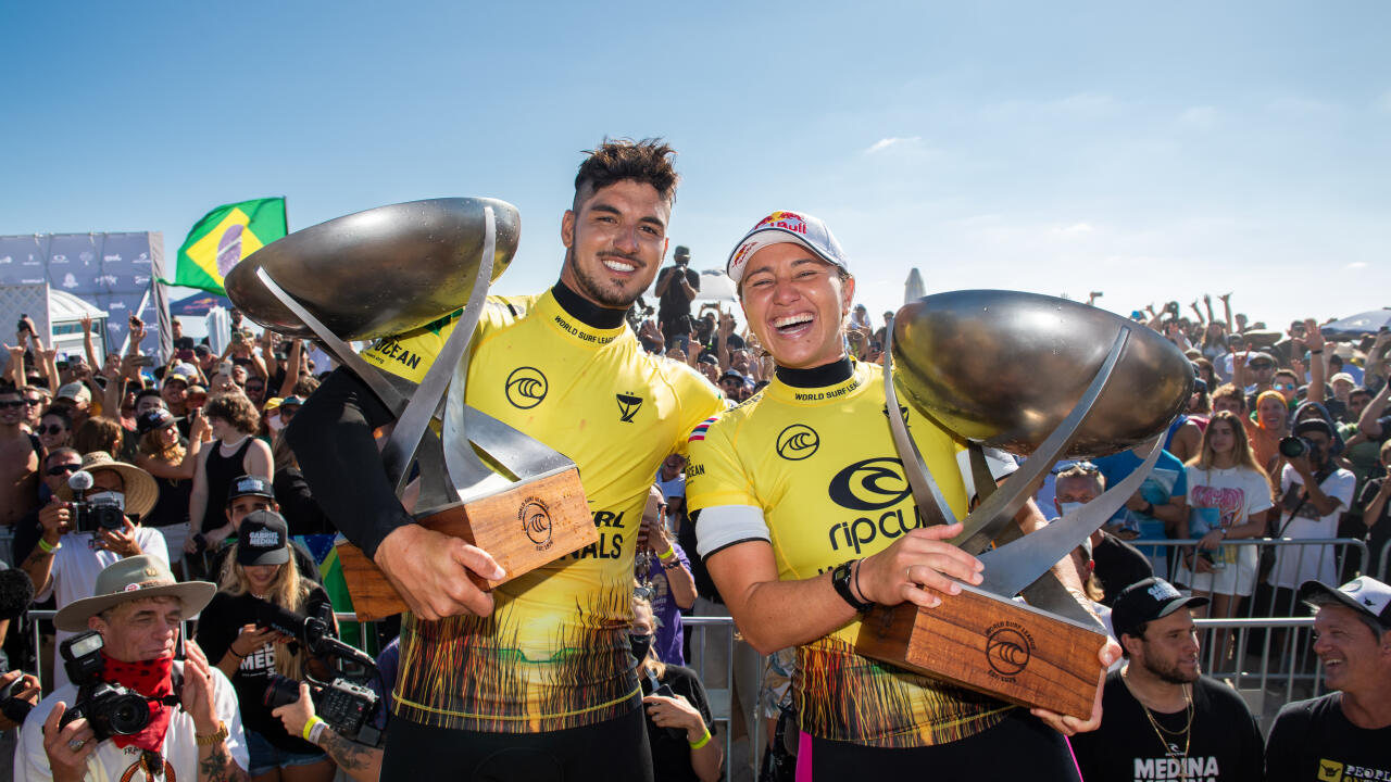 SAN CLEMENTE, CALIFORNIA, USA - SEPTEMBER 14: Four-time WSL Champion Carissa Moore of Hawaii and two-time WSL Champion Gabriel Medina of Brazil after surfing in the Title Match of the Rip Curl WSL Finals on September 14, 2021 at Lower Trestles, San Clemen