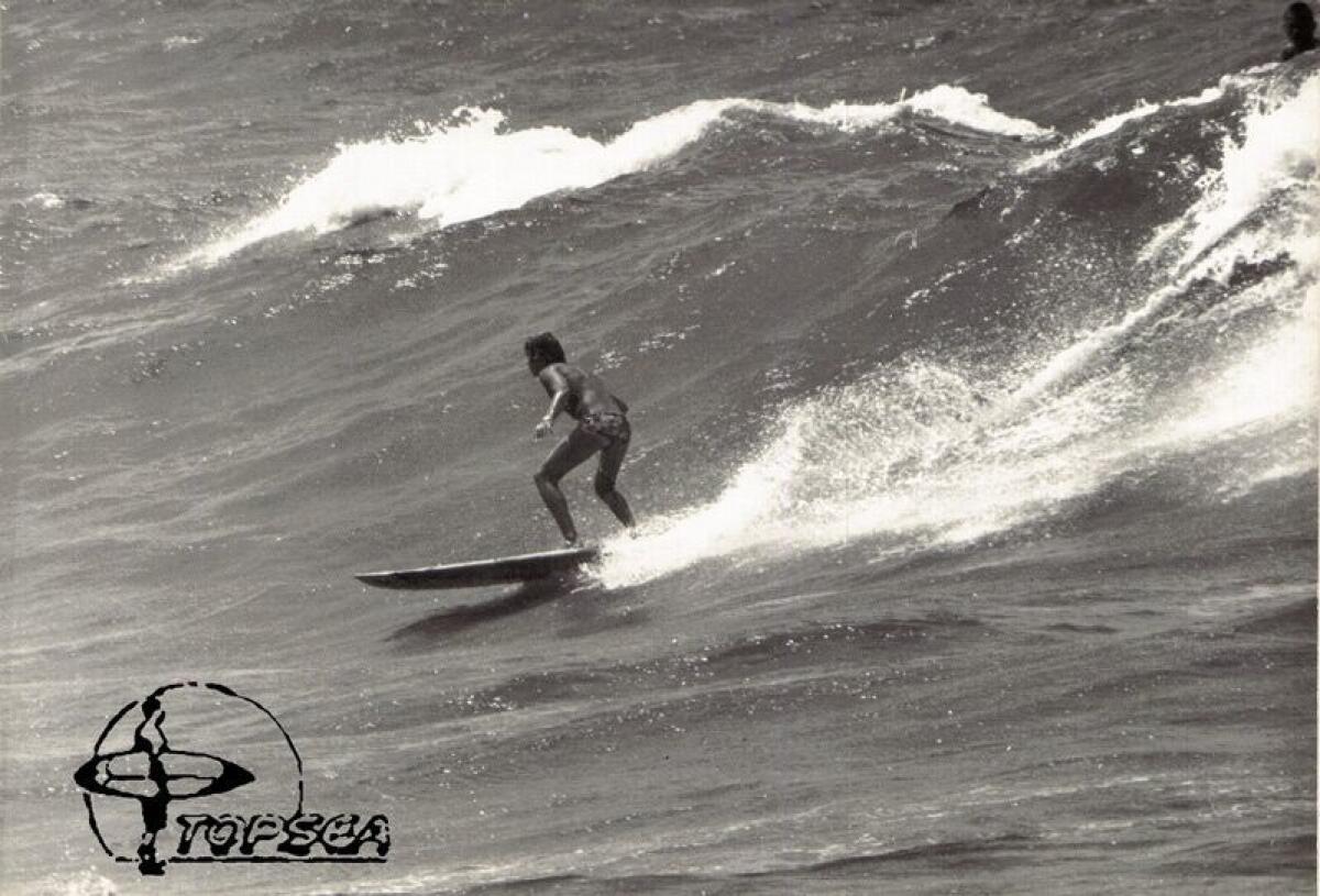 A surfer rides a wave in Tel Aviv in 1975